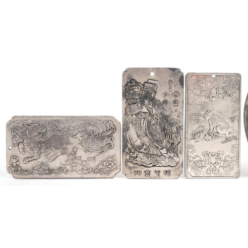 440 - A group of six Chinese metal scroll weights, 20th century, variously decorated, 10.5cm x 6cm.