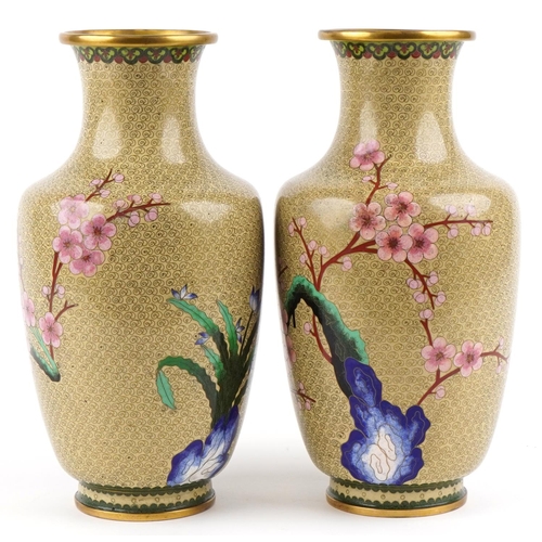 39 - A pair of Chinese cloisonné vases, 20th century, each with floral decoration, 39cm high.