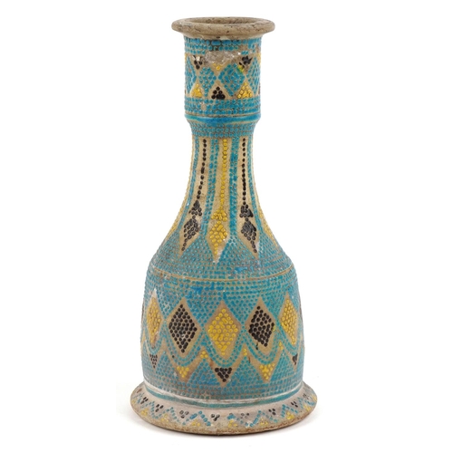 385 - A Middle Eastern stoneware pottery candlestick holder, early 20th century, with polychrome hand pain... 