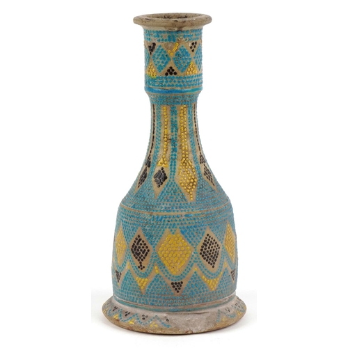 385 - A Middle Eastern stoneware pottery candlestick holder, early 20th century, with polychrome hand pain... 