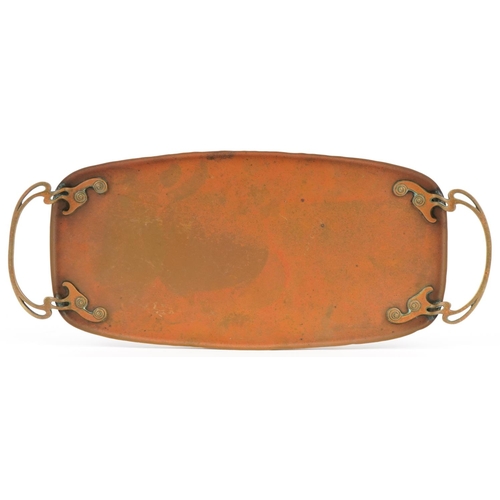 165 - An Art Nouveau WMF brass tray with twin stylized handles, 57cm wide.