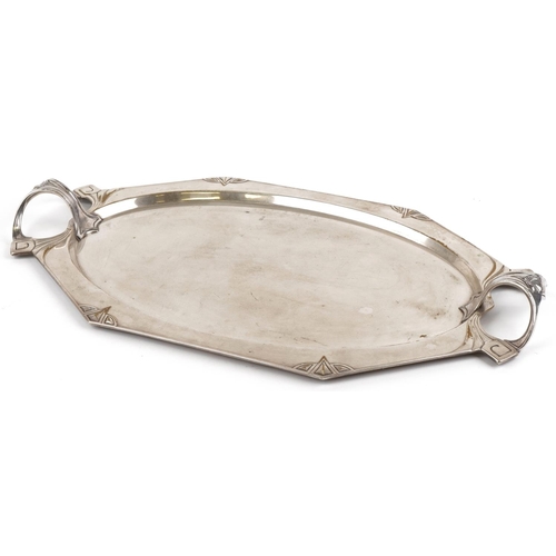 166 - An Art Nouveau Secessionist silver plated brass tray with stylized handles, 61cm wide.