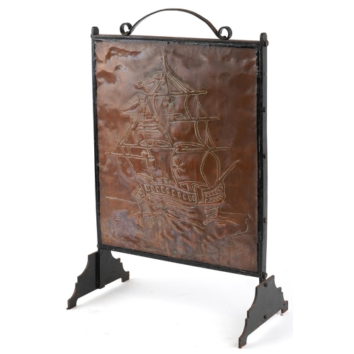 109 - An Edwardian Arts & Crafts copper and wrought iron fire screen circa 1910, the rectangular panel emb... 