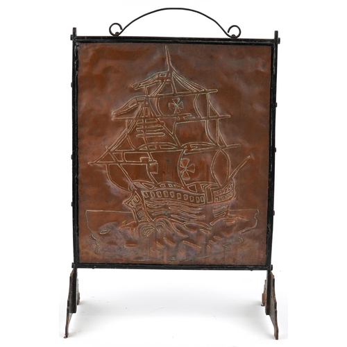 109 - An Edwardian Arts & Crafts copper and wrought iron fire screen circa 1910, the rectangular panel emb... 