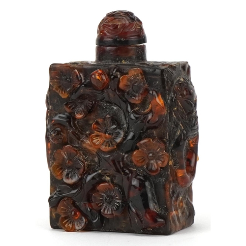 224 - A Chinese amber rectangular scent bottle and stopper, 20th century, with carved floral decoration, 8... 