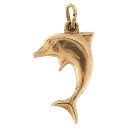 3418 - A 9ct gold charm in the form of a dolphin, 1.9cm high, 0.4g.