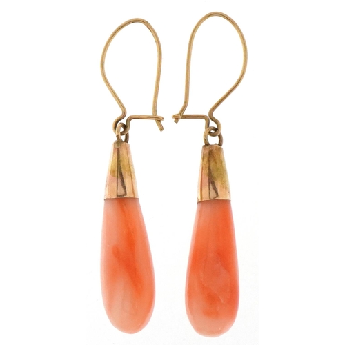 A pair of unmarked gold pink coral teardrop earrings, 3.7cm high, total ...