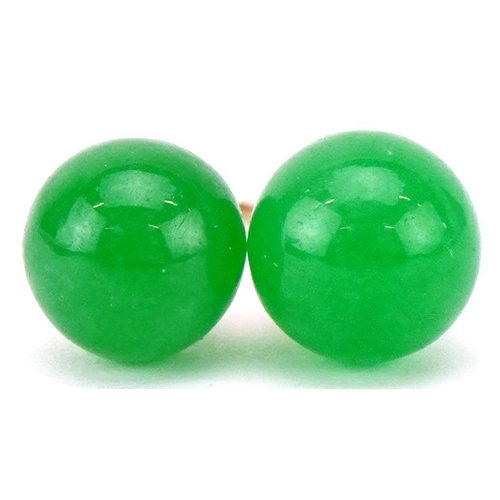 3128 - A pair of 9ct gold Chinese green jade stud earrings, 8.2mm in diameter, total 2.2g.