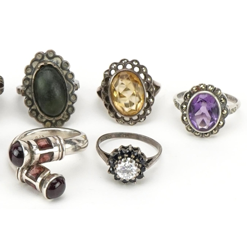 3712 - Ten vintage and later silver rings set with semi precious stones including marcasite, amethyst, garn... 