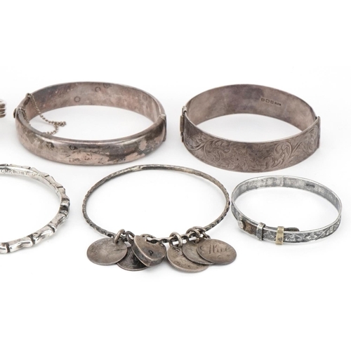 3714 - A collection of antique and later silver bracelets and bangles including a large cuff bracelet, tota... 