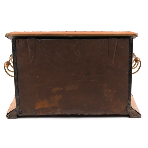 457 - An Art Nouveau copper and brass coal box having hinged lid and decorated with stylized motifs, 37cm ... 