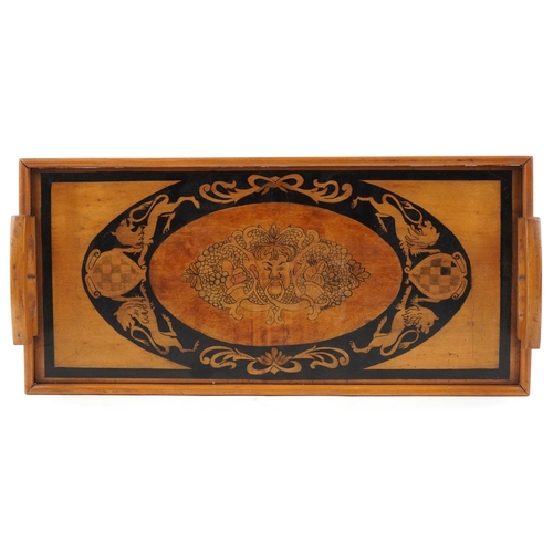 400 - An Edwardian Arts & Crafts satinwood rectangular tray with penwork decoration having two pierced han... 