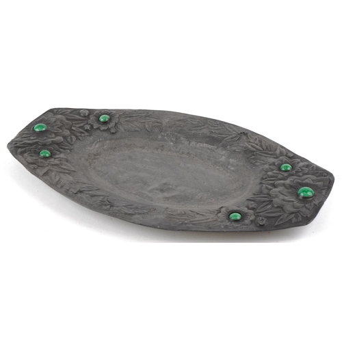 159 - An early 20th century Arts & Crafts pewter shallow dish with inset green hardstone cabochons and flo... 