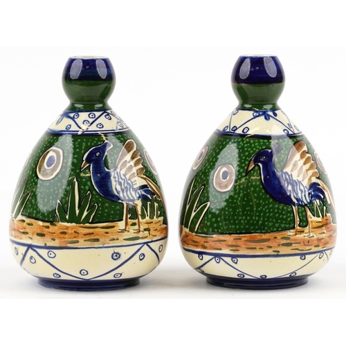 421 - A pair of 20th century, possibly Mexican, pottery vases, each with polychrome hand painted decoratio... 