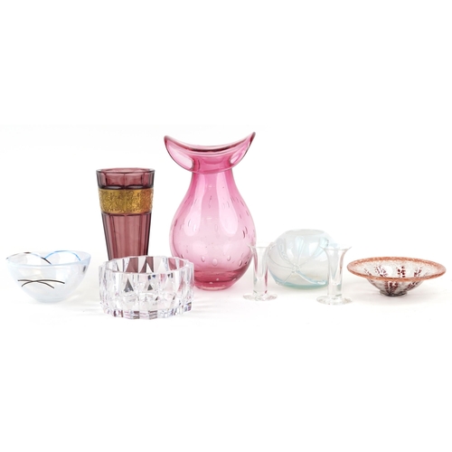 526 - Art glassware including a large cranberry coloured vase with controlled bubble decoration, two Kosta... 