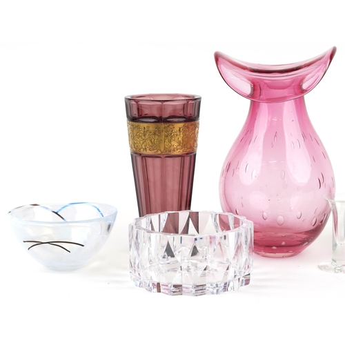 526 - Art glassware including a large cranberry coloured vase with controlled bubble decoration, two Kosta... 