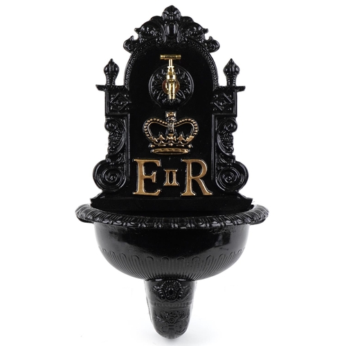 2620 - A black painted metal Elizabeth II water font, 72cm high.