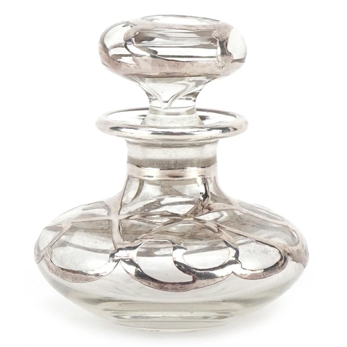 595 - An unmarked silver overlaid glass scent bottle, 6cm high.