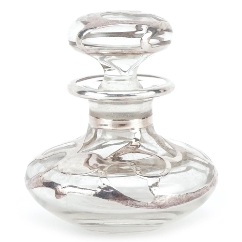 595 - An unmarked silver overlaid glass scent bottle, 6cm high.