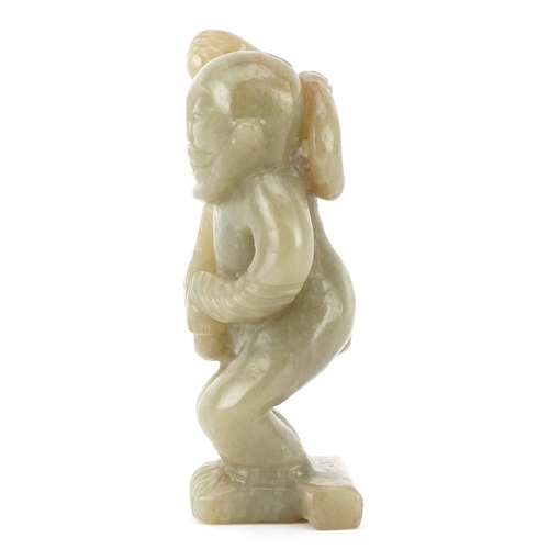 389 - A carved hardstone study of a mythical figure, 8cm high.