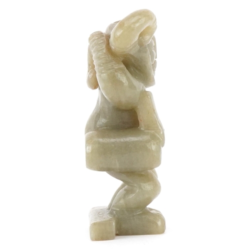 389 - A carved hardstone study of a mythical figure, 8cm high.