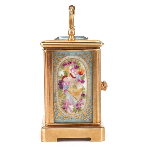 204 - A miniature gilt brass cased carriage clock with Sevres type porcelain panels hand painted with flow... 