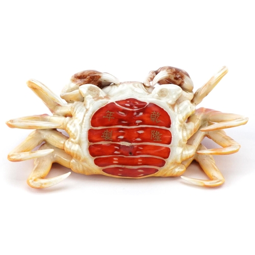 1606 - A Japanese porcelain study of a crab, character marks to the base, 12.5cm wide.