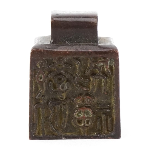 1632 - A Chinese patinated bronze desk seal scroll weight, 3cm high, 108.8g.