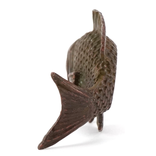 1619 - A Japanese patinated bronze scroll weight in the form of a fish, character marks to the base, 5cm in... 