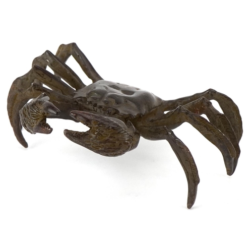 1623 - A Japanese patinated bronze study of a crab, character marks to the base, 11.5cm wide.