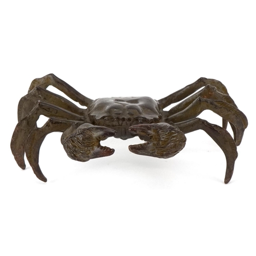 1623 - A Japanese patinated bronze study of a crab, character marks to the base, 11.5cm wide.