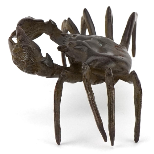 1623 - A Japanese patinated bronze study of a crab, character marks to the base, 11.5cm wide.