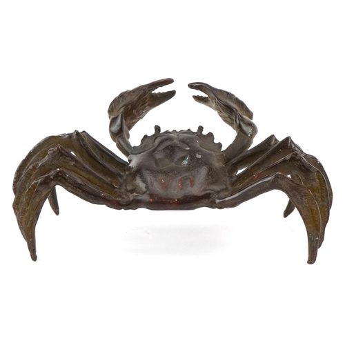 1623 - A Japanese patinated bronze study of a crab, character marks to the base, 11.5cm wide.