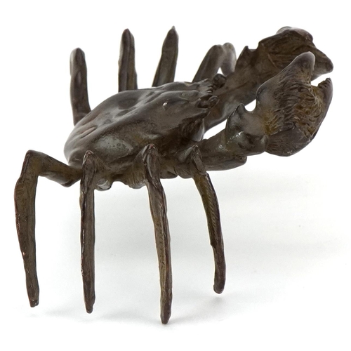 1623 - A Japanese patinated bronze study of a crab, character marks to the base, 11.5cm wide.