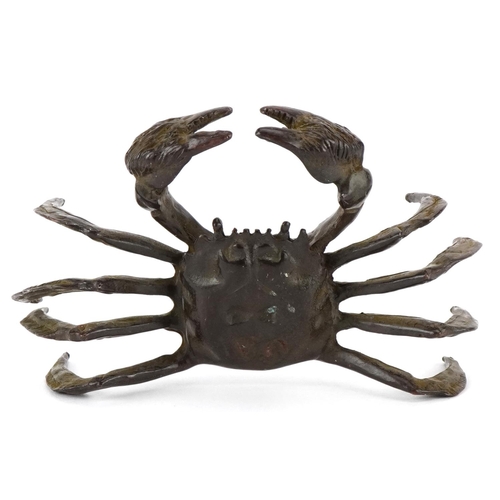 1623 - A Japanese patinated bronze study of a crab, character marks to the base, 11.5cm wide.