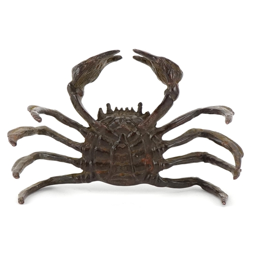 1623 - A Japanese patinated bronze study of a crab, character marks to the base, 11.5cm wide.