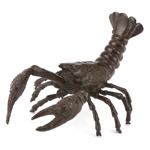 1602 - A Japanese patinated bronze study of a crayfish, 9cm in length.