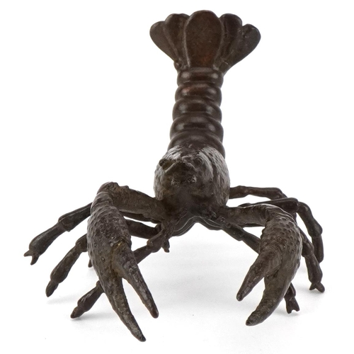 1602 - A Japanese patinated bronze study of a crayfish, 9cm in length.