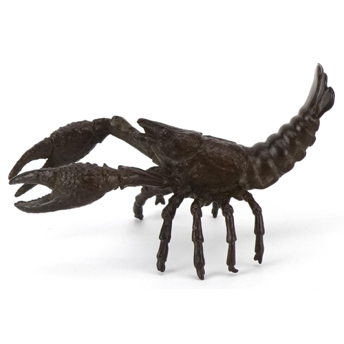 1602 - A Japanese patinated bronze study of a crayfish, 9cm in length.