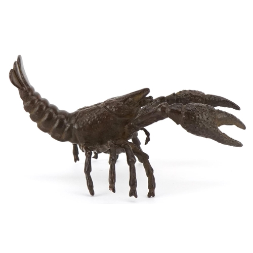 1602 - A Japanese patinated bronze study of a crayfish, 9cm in length.