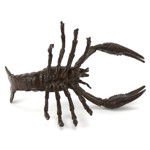 1602 - A Japanese patinated bronze study of a crayfish, 9cm in length.