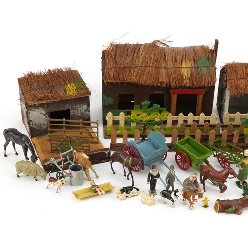 1101 - A small collection of early to mid 20th century Britains diecast farmyard animals, people, carts and... 