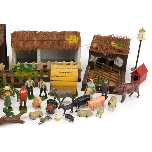 1101 - A small collection of early to mid 20th century Britains diecast farmyard animals, people, carts and... 