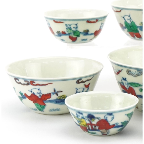 37 - A set of nine Chinese graduated porcelain bowls, 20th century, each with hand painted decoration, be... 