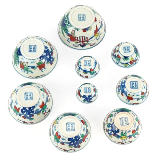 37 - A set of nine Chinese graduated porcelain bowls, 20th century, each with hand painted decoration, be... 