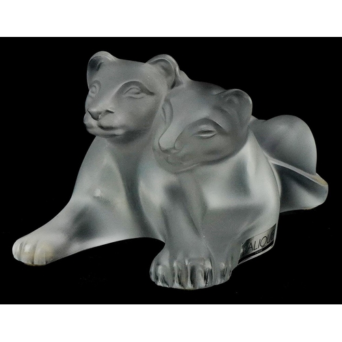 173 - Lalique, a frosted glass study of two lion cubs, etched Lalique France to the base, 12.5cm in length... 