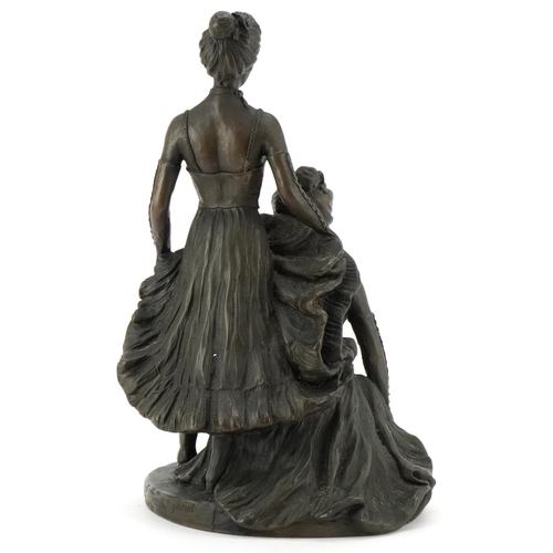 486 - A bronzed study of two scantily dressed females, 32cm high.