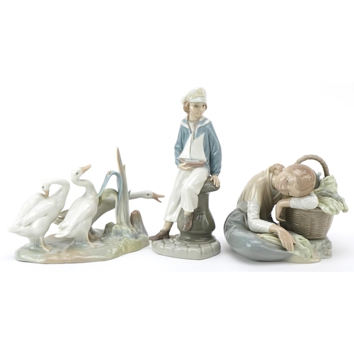 1004 - Three Lladro figures including a young girl with a vegetable basket and young boy with a model pond ... 