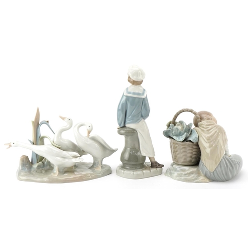 1004 - Three Lladro figures including a young girl with a vegetable basket and young boy with a model pond ... 