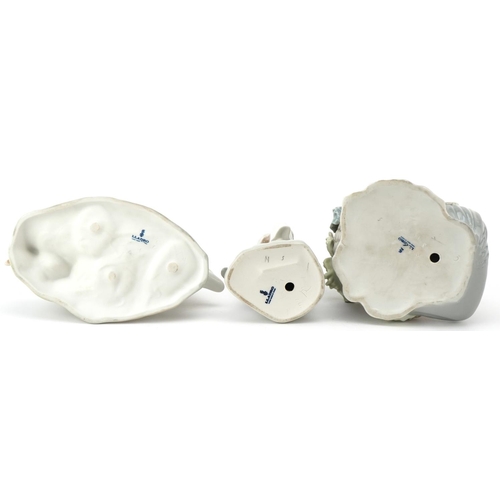 1004 - Three Lladro figures including a young girl with a vegetable basket and young boy with a model pond ... 